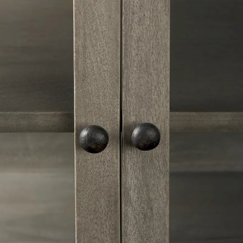Accentkast van massief hout met zwart ijzeren frame en glazen deuren